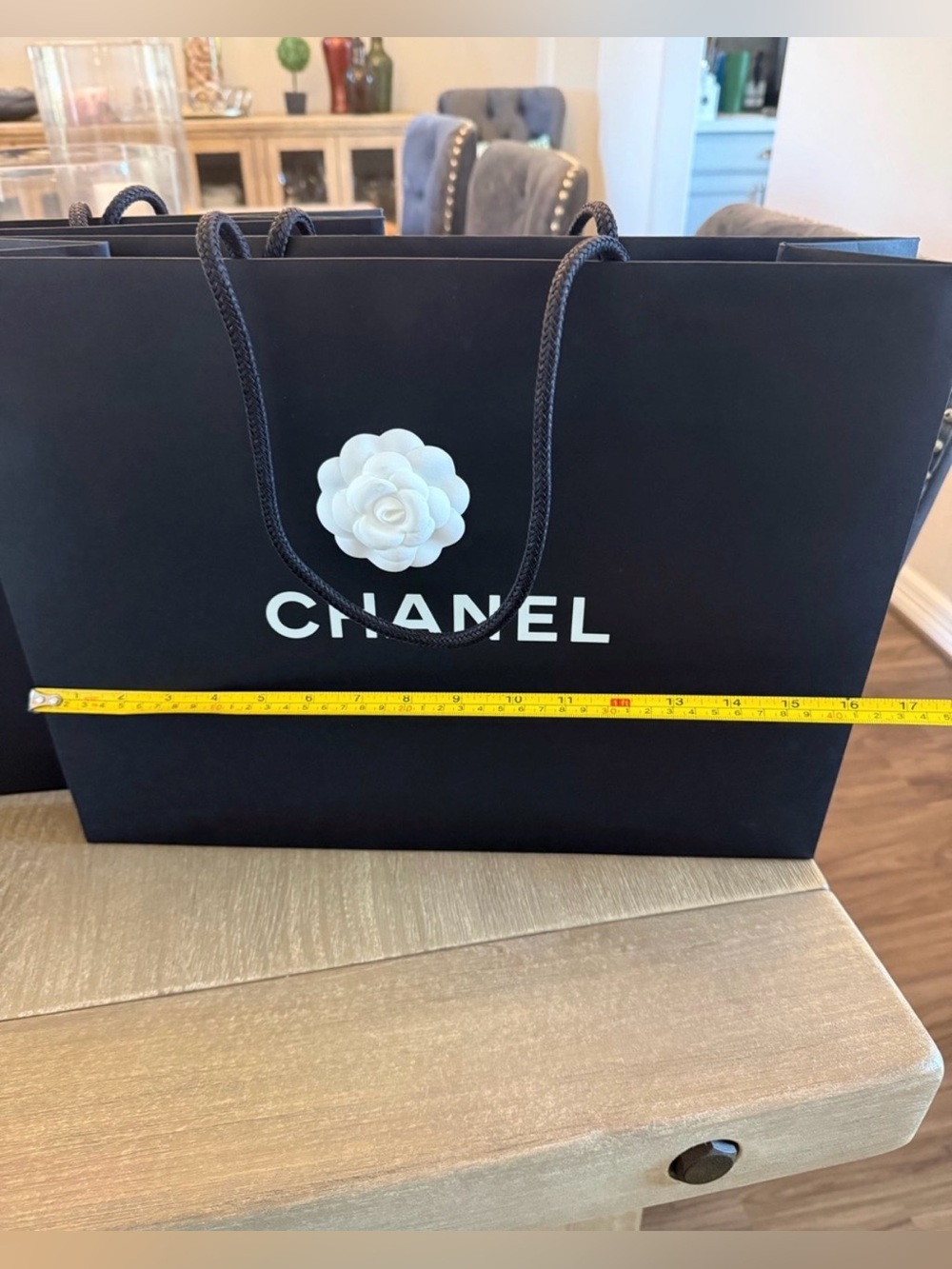 CHANEL Black paper bag with White Camellia Accent